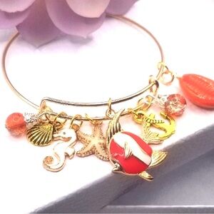 gold-toned expandable charm bangle bracelet "sea life" or "nautical"